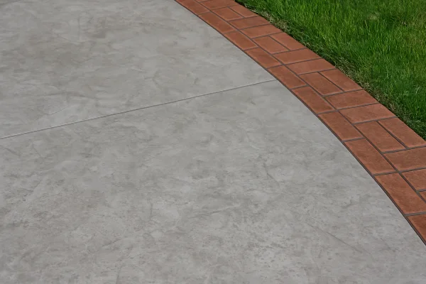 a section of a concrete patio from TJ Concrete Contractor in Dallas, TX - driveway resurfacing